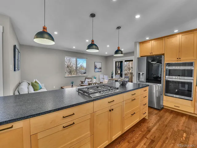 a kitchen with sink and cabinets