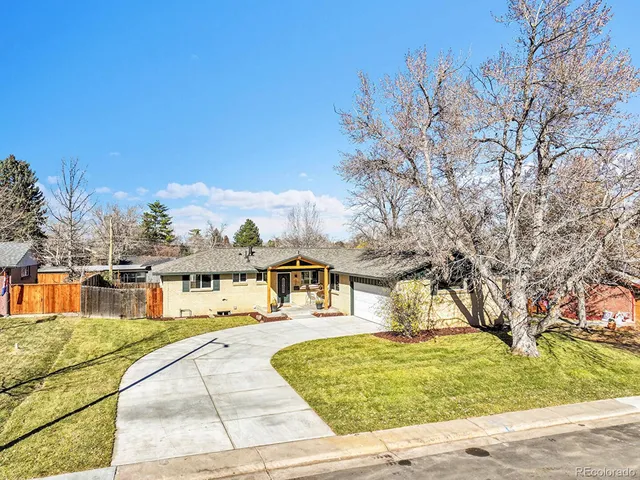 a view of swimming pool with outdoor seating and yard