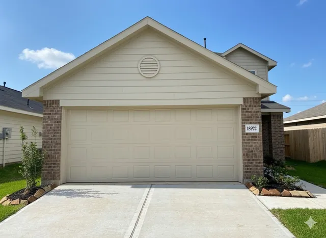 a view of house with garage