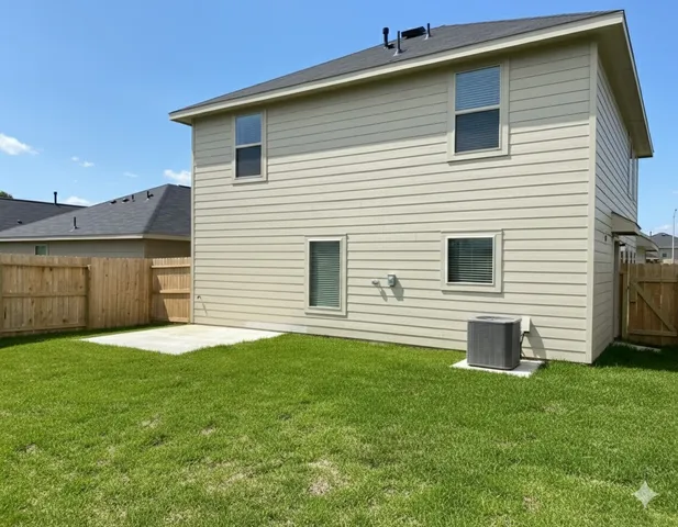 a backyard of a house with potted plants