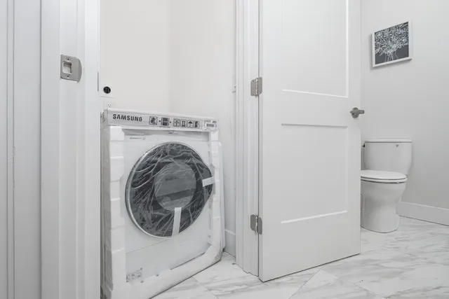 a utility room with dryer and washer