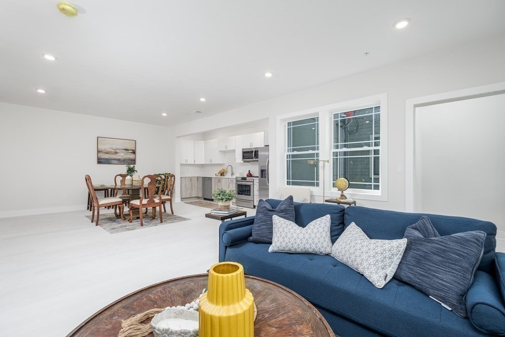 1540 North Shore Road, Unit 301 Revere, MA 02151 - Photo 3 of 14 a living room with furniture and a couch