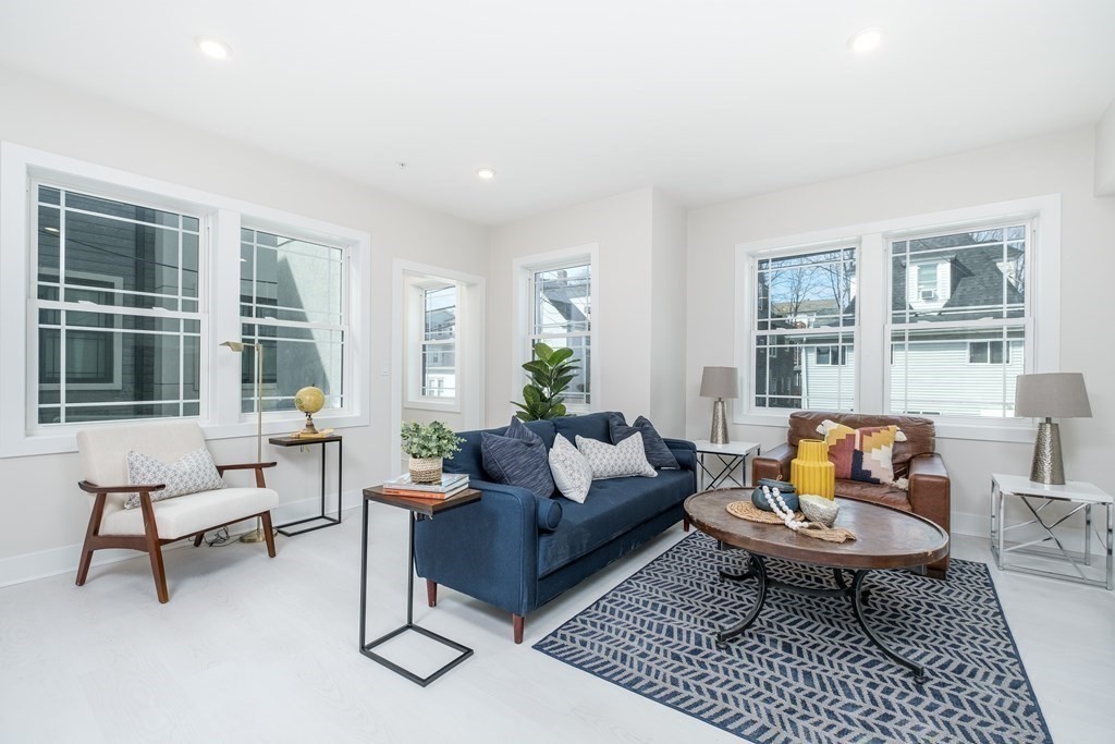 1540 North Shore Road, Unit 301 Revere, MA 02151 - Photo 5 of 14 a living room with furniture and a window