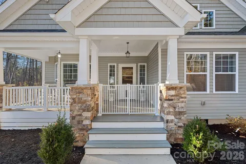 a front view of a house with large windows