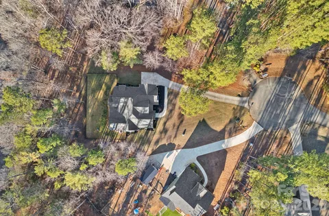 front view of a house with a tree