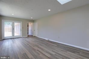 2582 Abby Lane Dover, PA 17315 - Photo 14 of 22 a view of an empty room with wooden floor and window