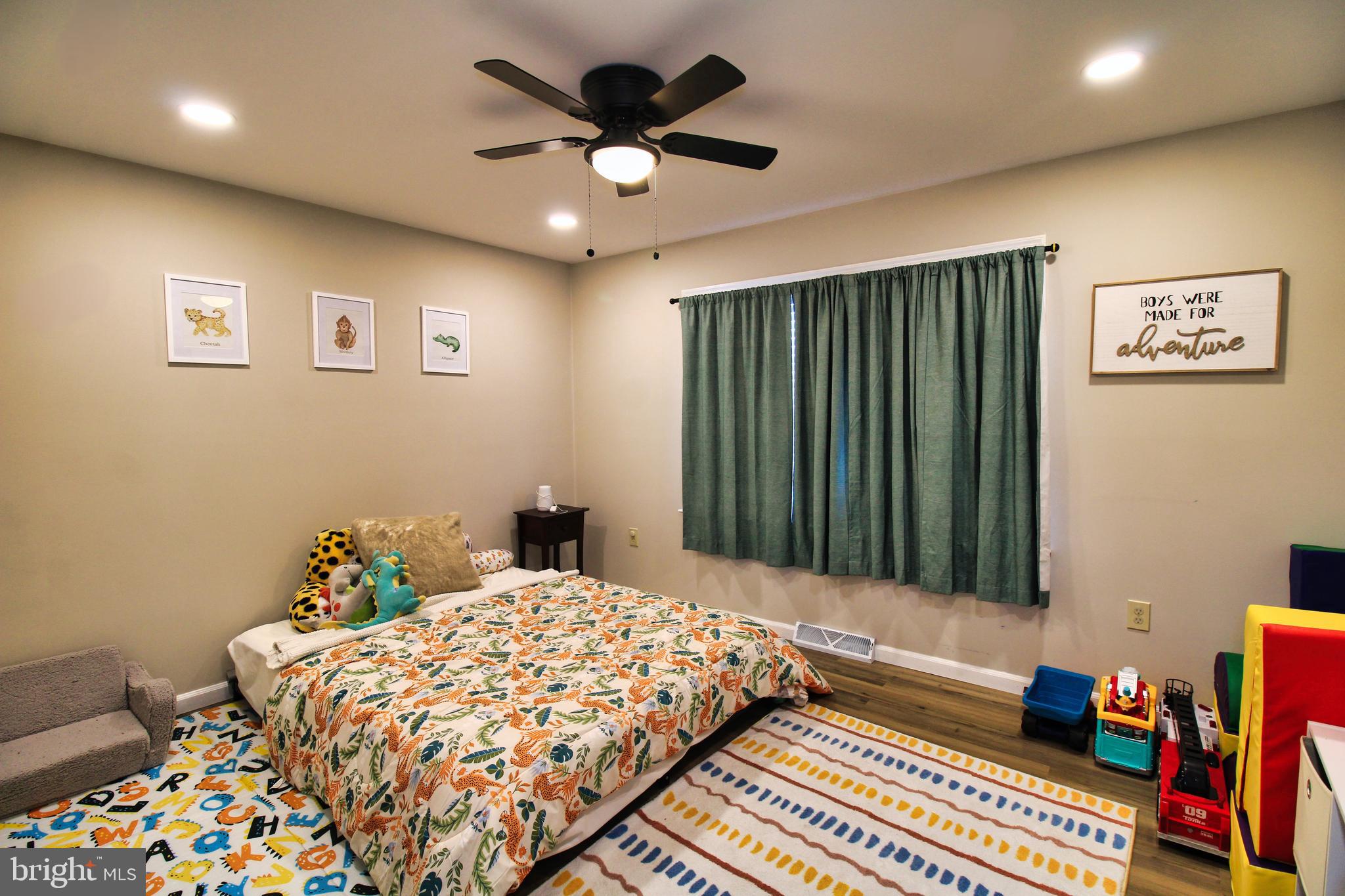 2582 Abby Lane Dover, PA 17315 - Photo 7 of 22 a bedroom with a bed and a chandelier