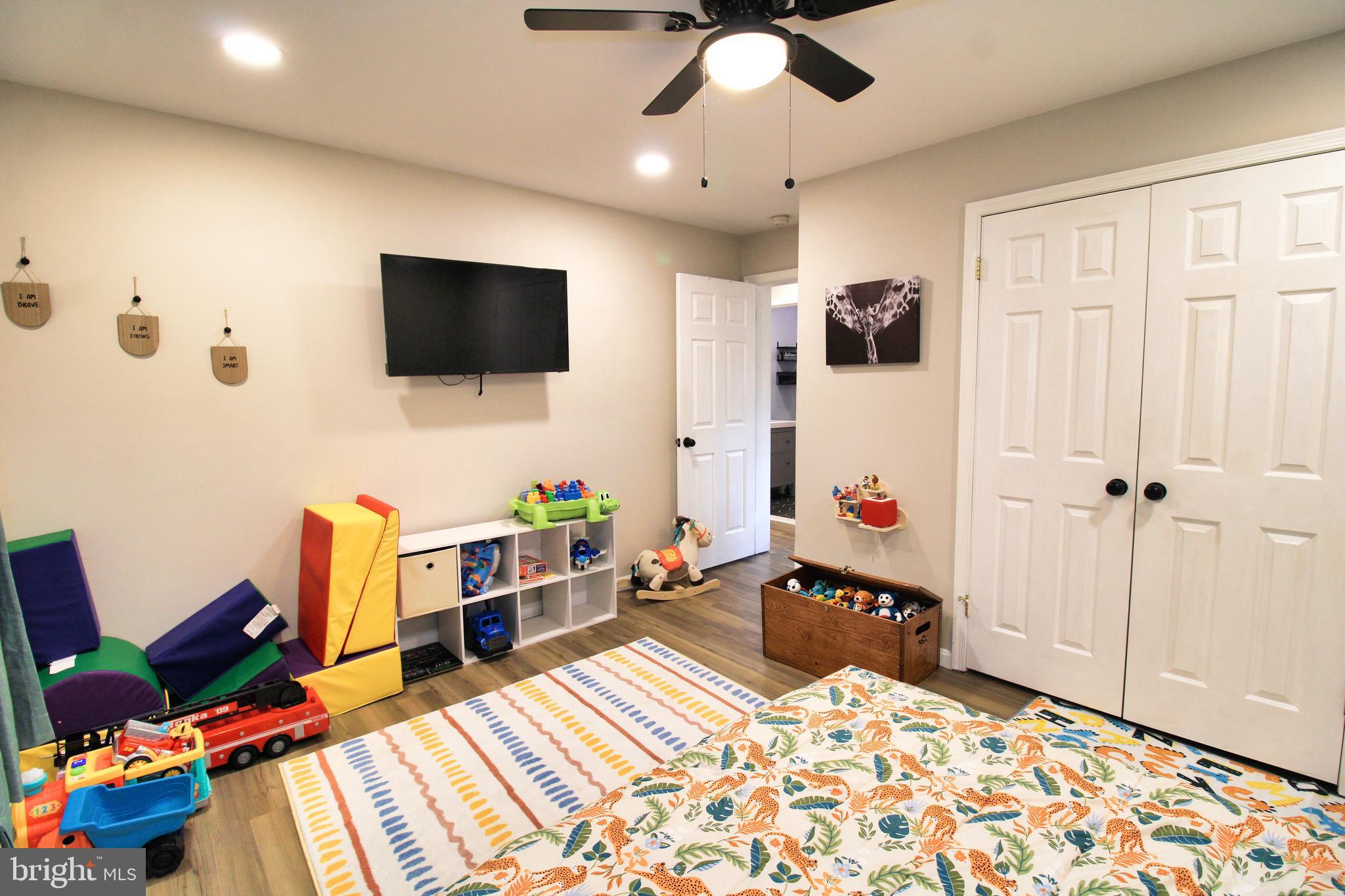 2582 Abby Lane Dover, PA 17315 - Photo 8 of 22 a bedroom with furniture and a flat screen tv