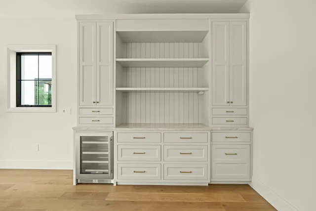 a view of an empty room with cabinet