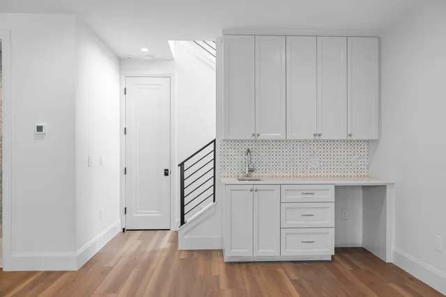 a view of cabinets and wooden floor
