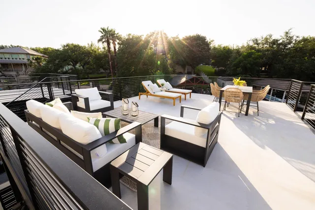 a view of a terrace with couches and wooden floor