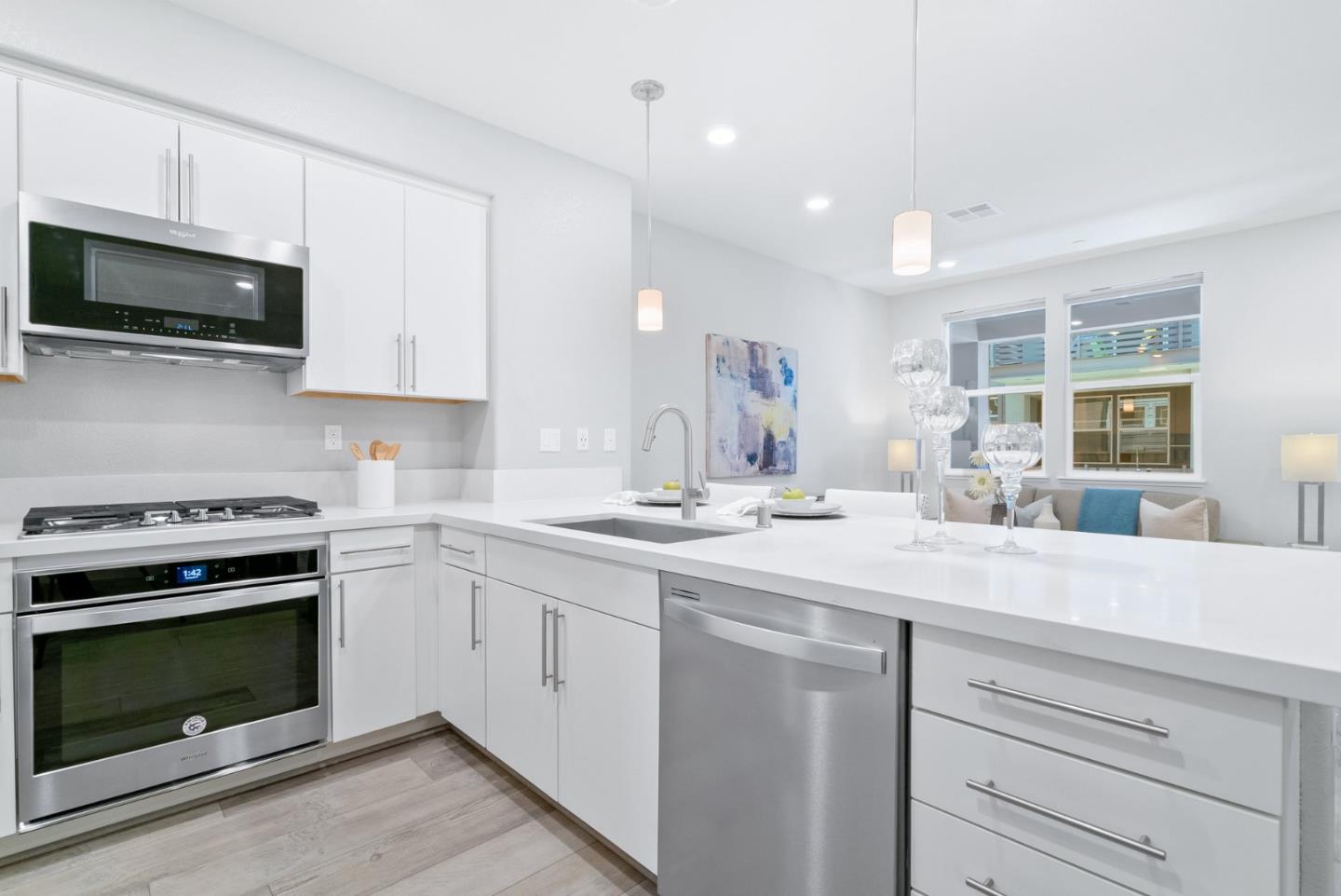 633 Clover Circle Milpitas, CA 95035 - Photo 15 of 36 a kitchen with a stove and a microwave oven