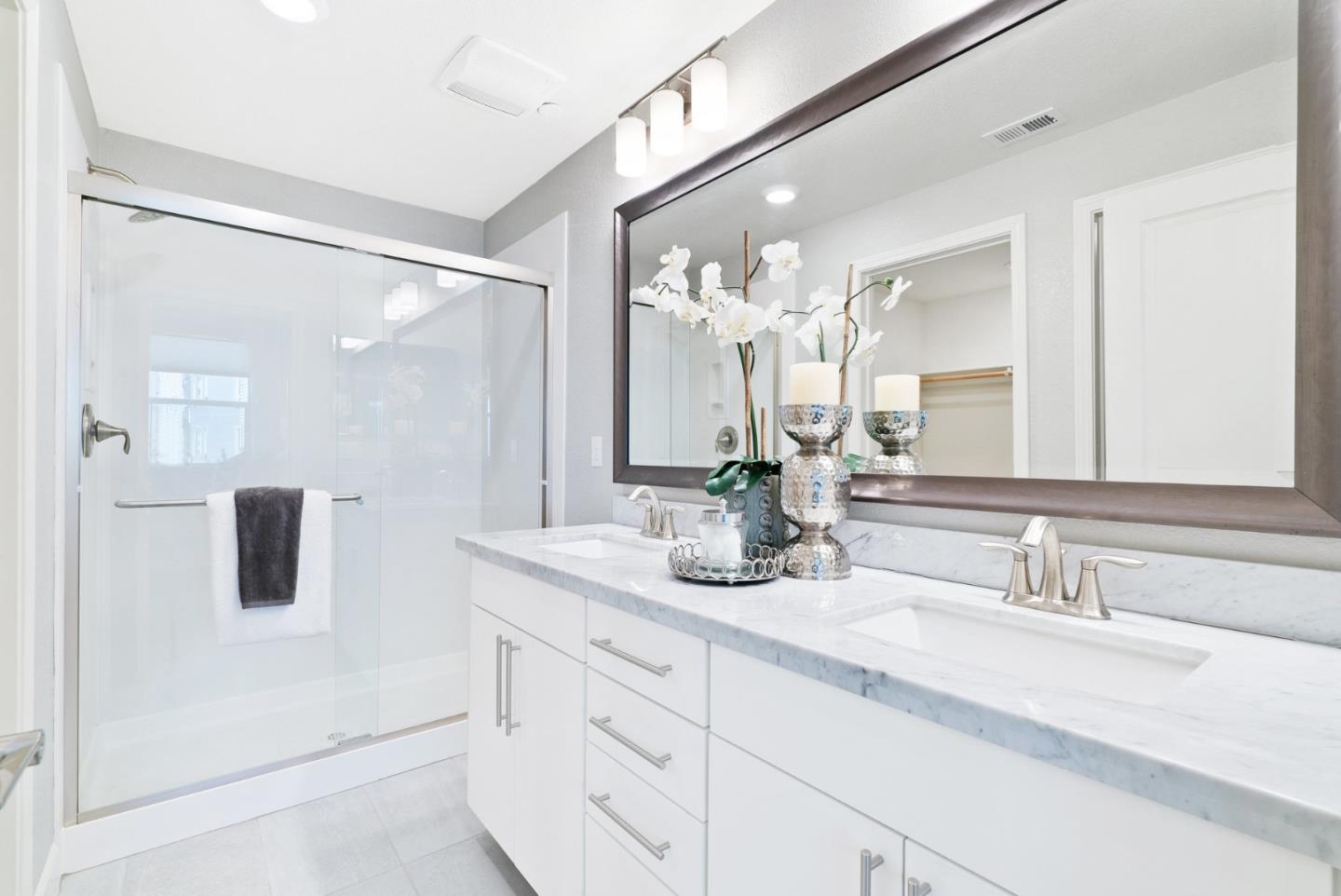 633 Clover Circle Milpitas, CA 95035 - Photo 22 of 36 a bathroom with a double vanity sink and mirror