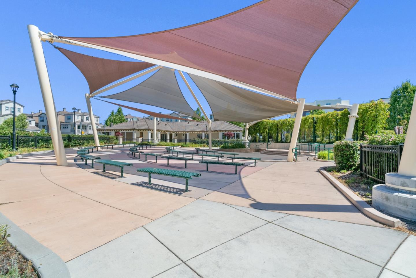 633 Clover Circle Milpitas, CA 95035 - Photo 34 of 36 a view of a patio with a table and chairs under an umbrella