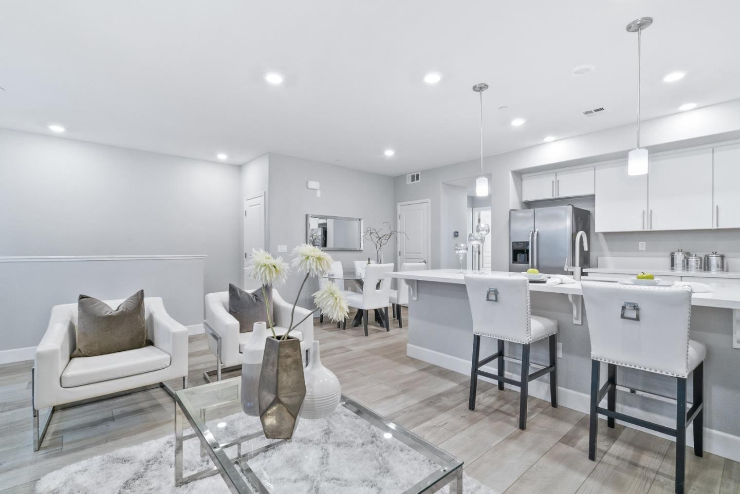 633 Clover Circle Milpitas, CA 95035 - Photo 10 of 36 a kitchen with a dining table chairs and view of living room