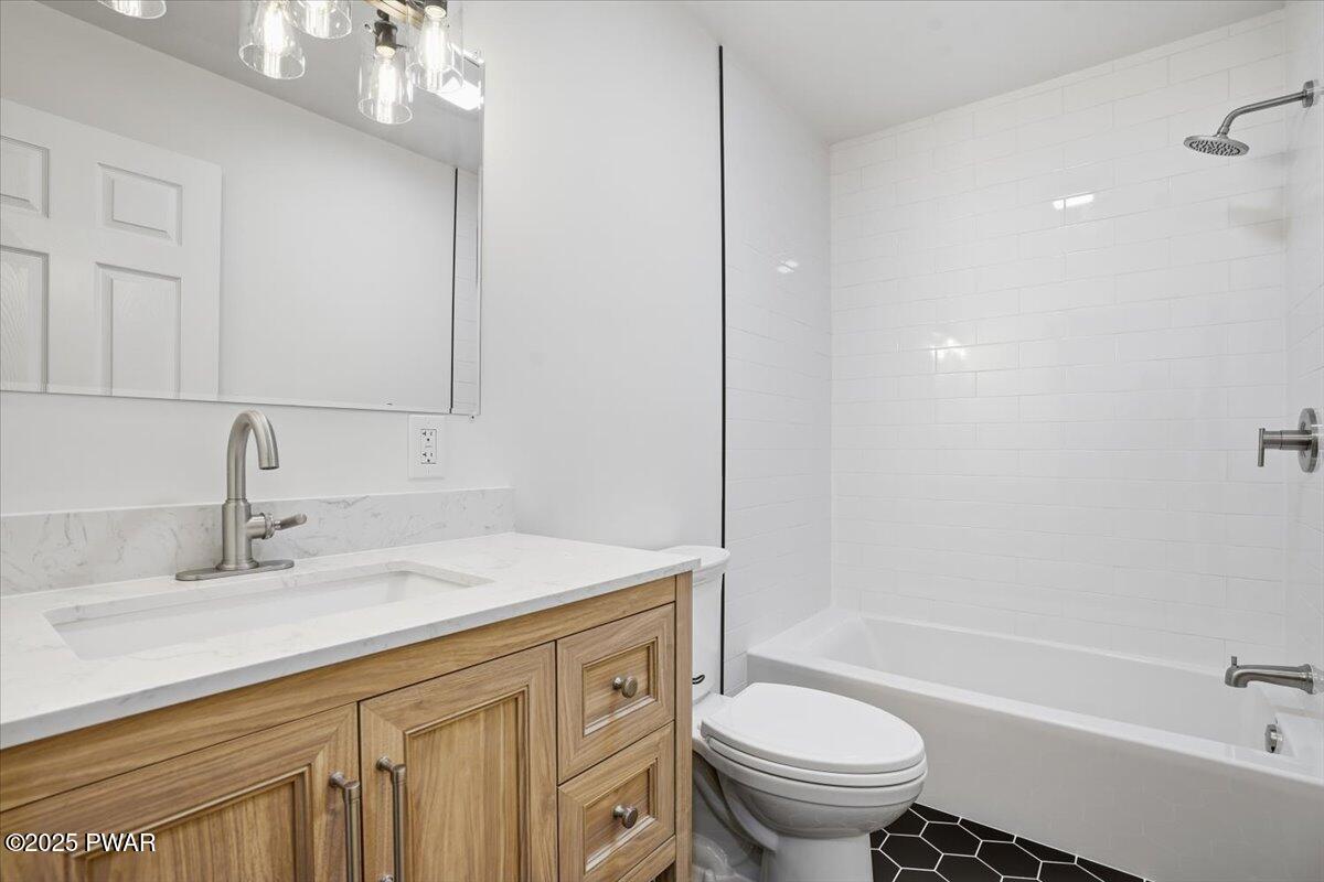 10 Swingle Road Moscow, PA 18444 - Photo 34 of 60 a bathroom with a sink a toilet and a bathtub