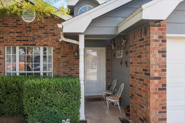 a brick building with a bench and a bench