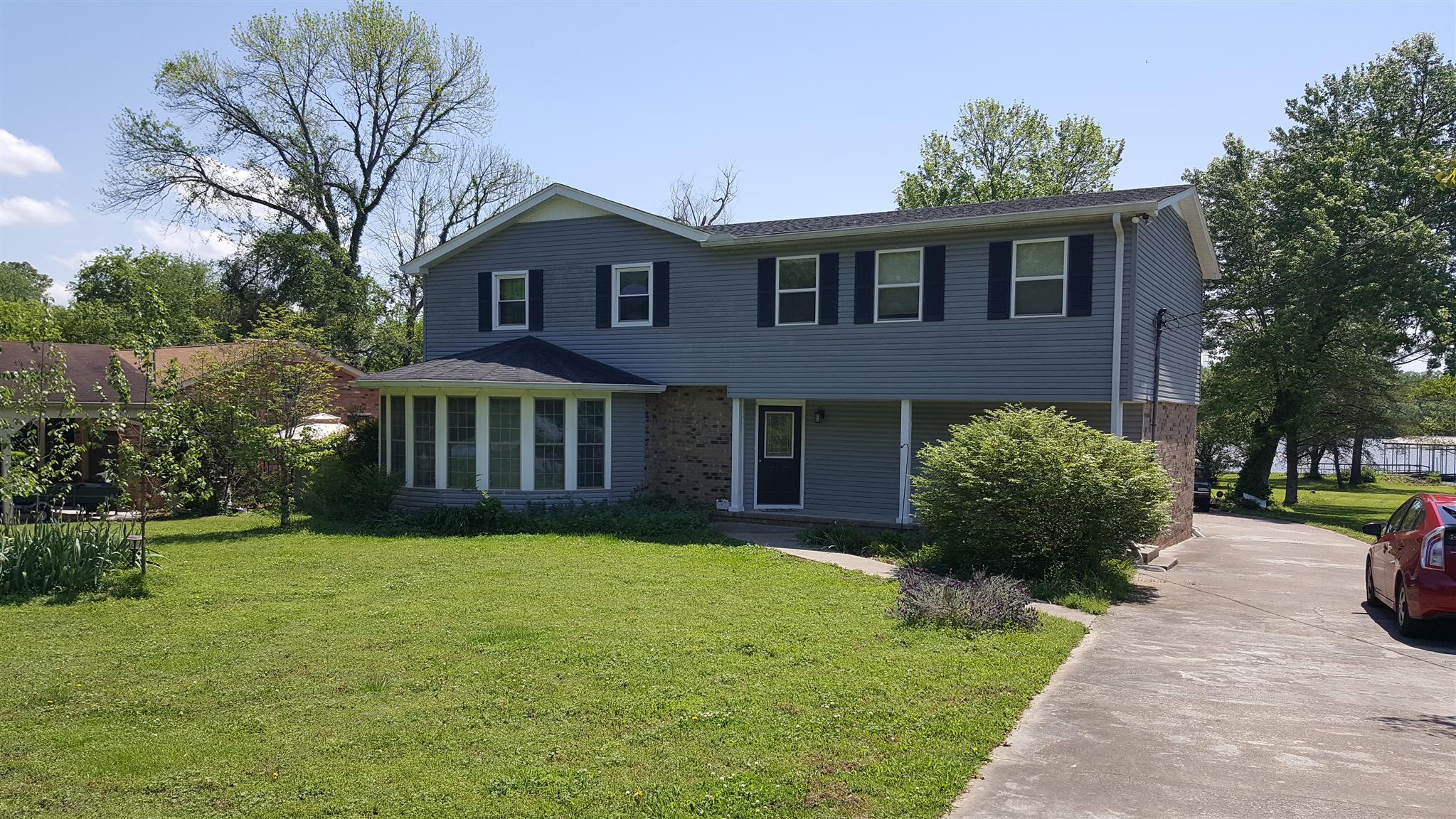 a view of a house with a yard and plants