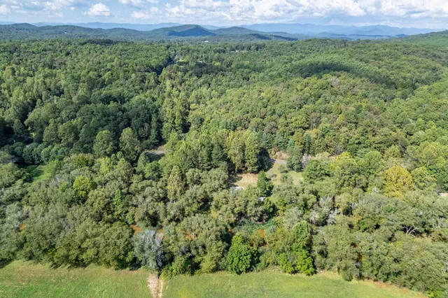 an aerial view of residential houses and outdoor space
