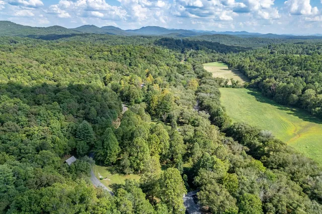 a view of a street with a building in the background