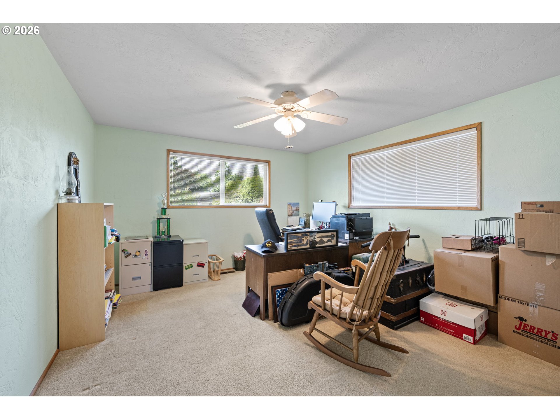 2465 17th Street Springfield, OR 97477 - Photo 24 of 47 a living room with furniture a ceiling fan and a window