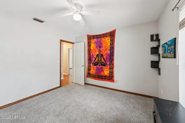 a view of a house with backyard sitting area and garden
