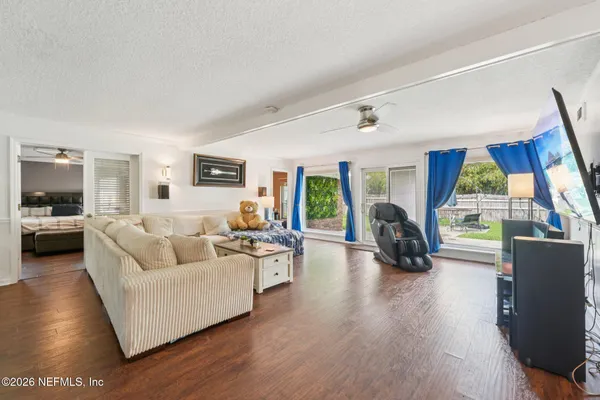 a living room with furniture and a window