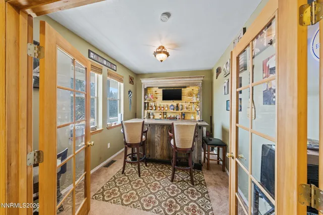 a dining room with furniture and a fireplace