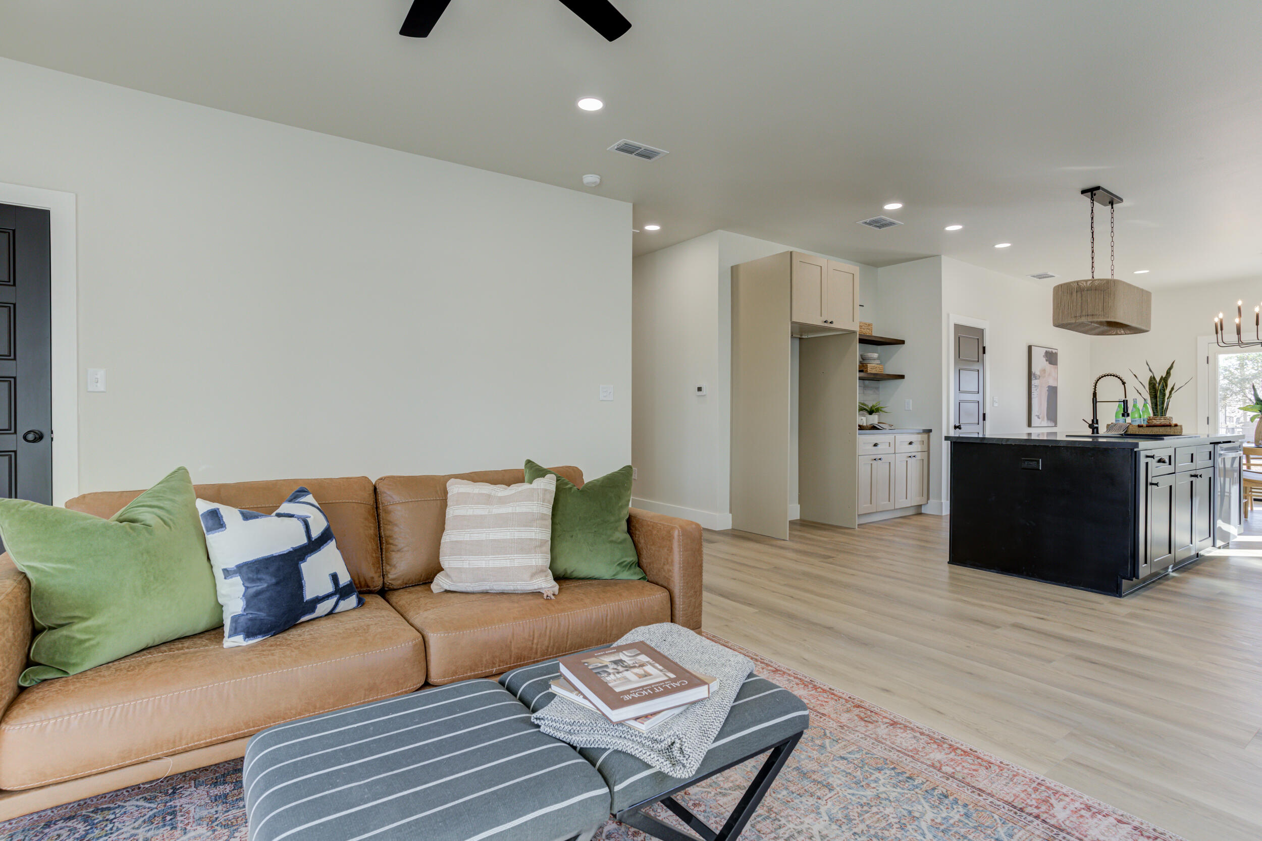 305 Southwest Ave L Seminole, TX 79360 - Photo 13 of 52 a living room with furniture and a wooden floor