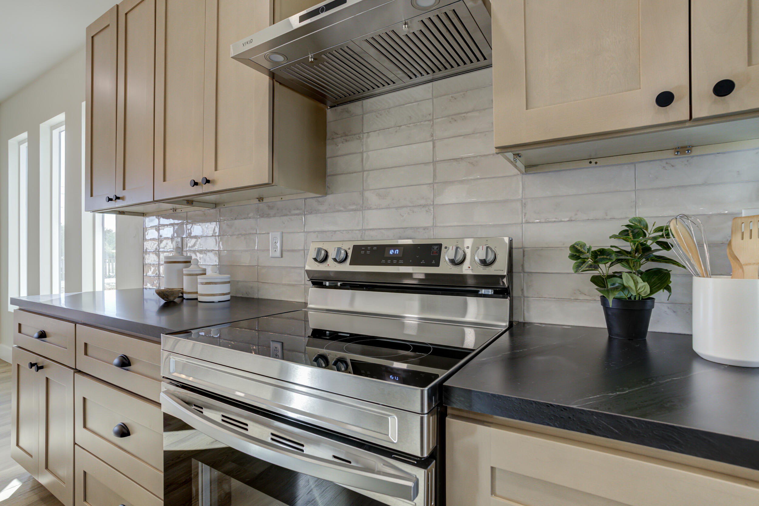 305 Southwest Ave L Seminole, TX 79360 - Photo 19 of 52 a kitchen with a potted plant on the counter