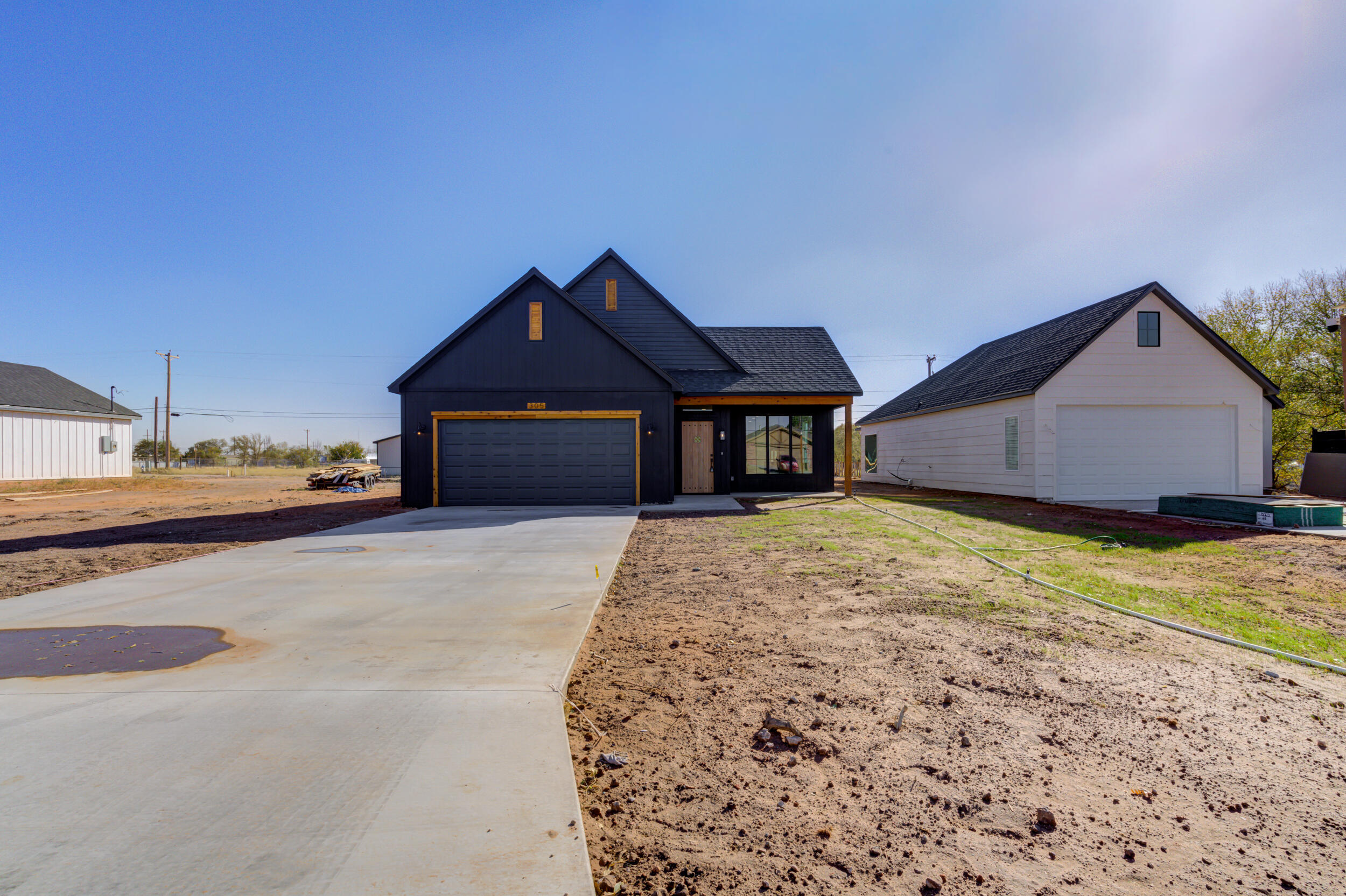 305 Southwest Ave L Seminole, TX 79360 - Photo 2 of 52 a front view of a house with a yard
