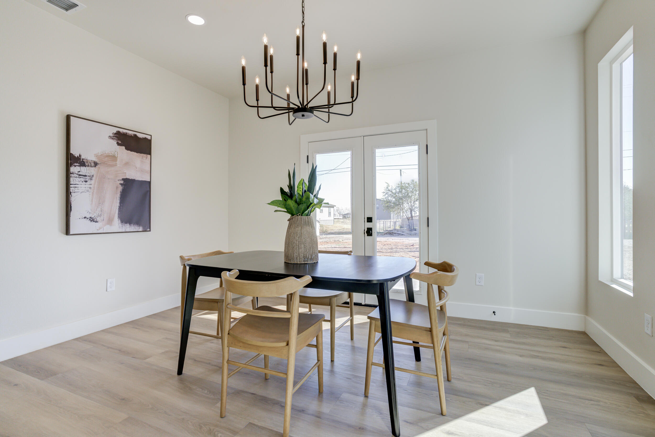 305 Southwest Ave L Seminole, TX 79360 - Photo 27 of 52 a view of a dining room with furniture window and wooden floor