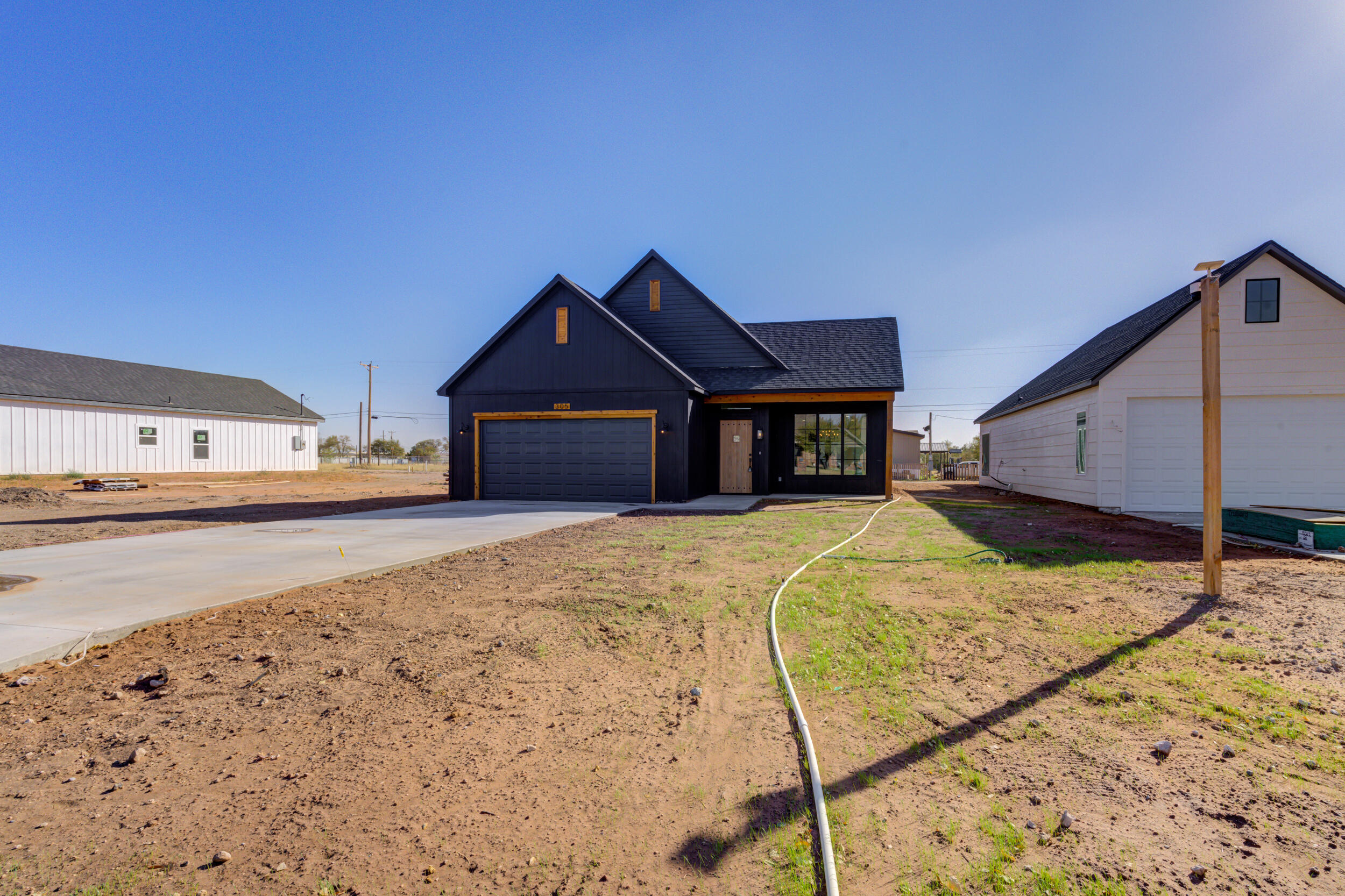 305 Southwest Ave L Seminole, TX 79360 - Photo 3 of 52 a front view of a house with a yard