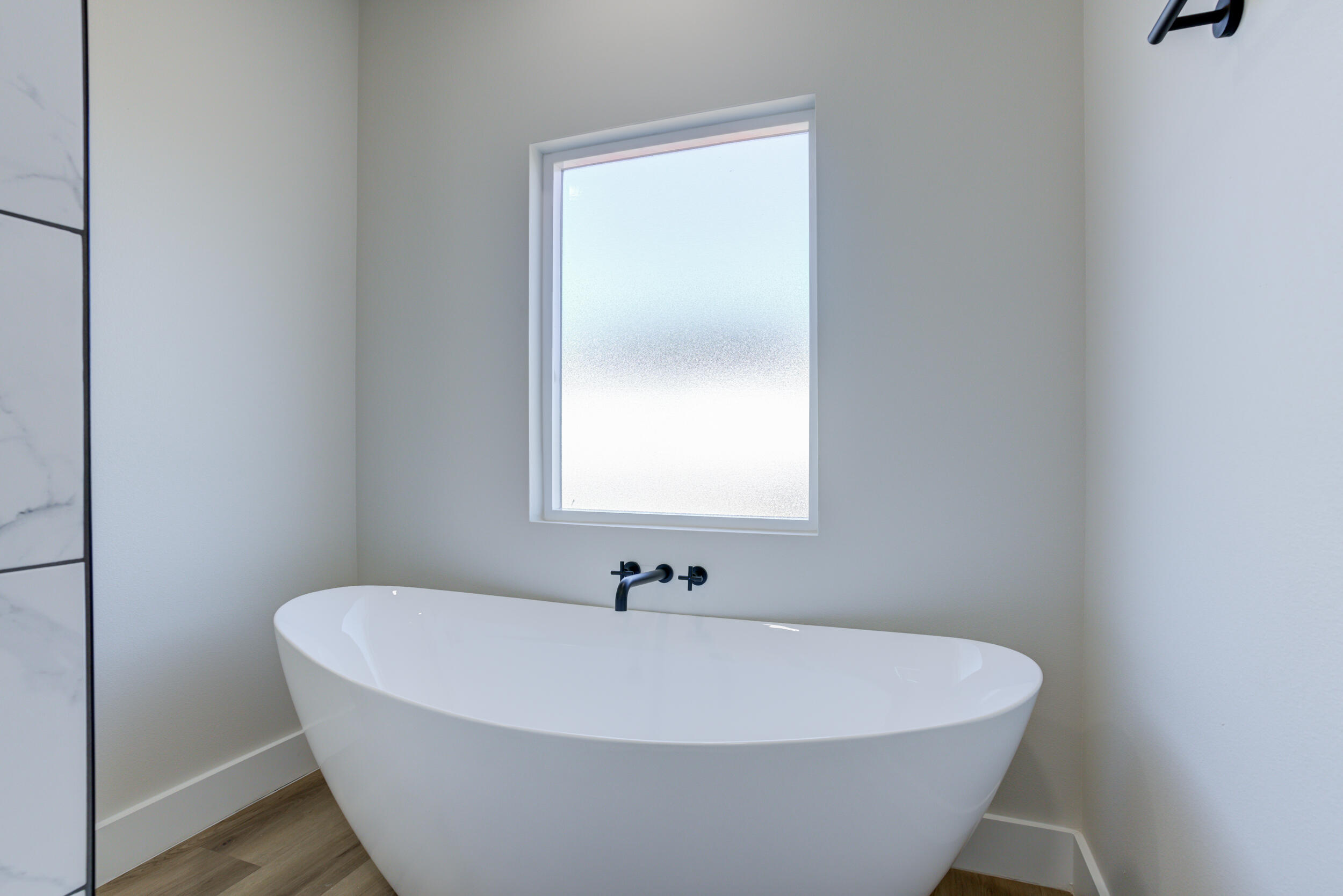 305 Southwest Ave L Seminole, TX 79360 - Photo 48 of 52 a white bath tub sitting in a bathroom