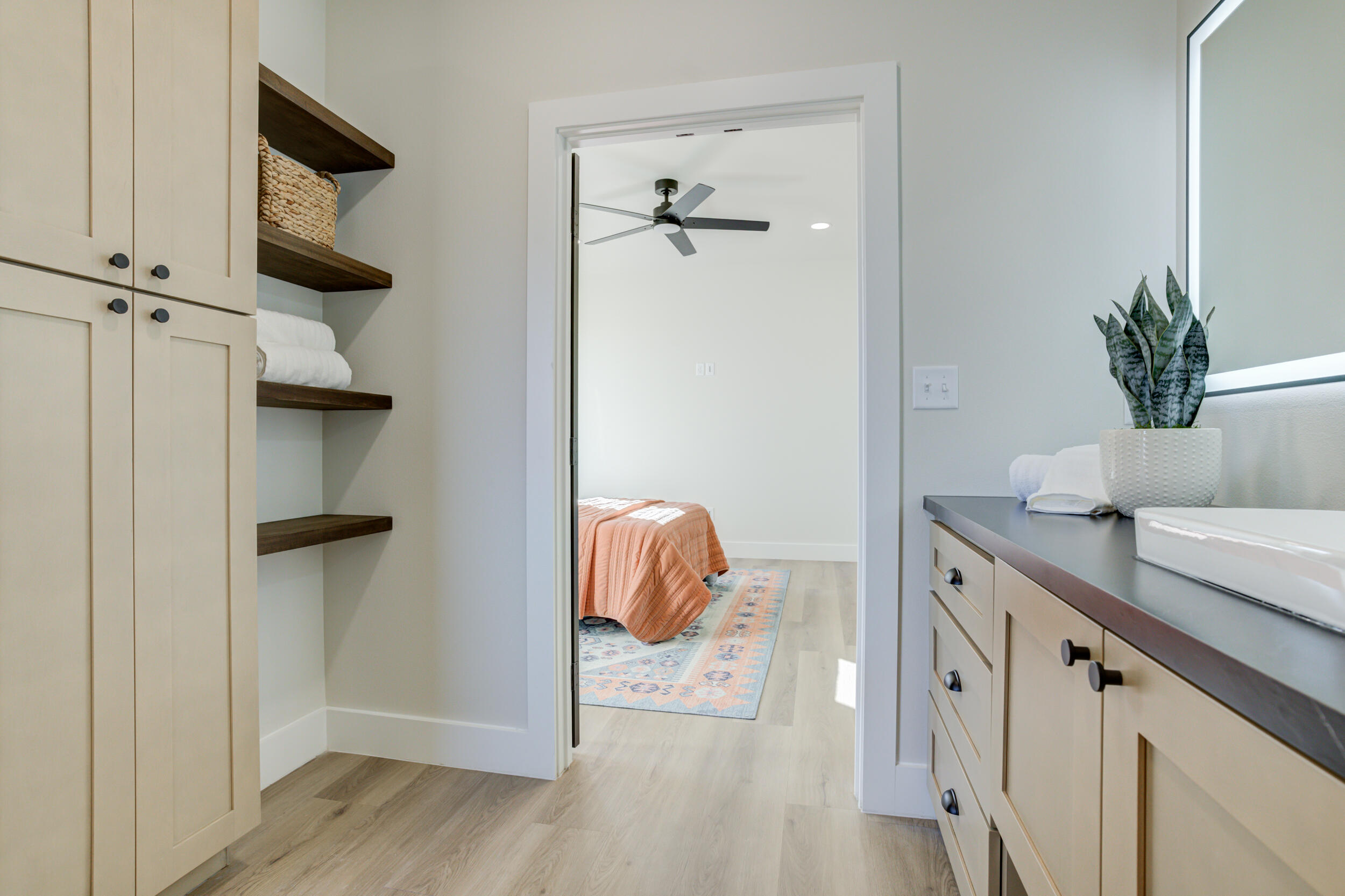 305 Southwest Ave L Seminole, TX 79360 - Photo 50 of 52 a bathroom with a granite countertop sink a mirror and shower