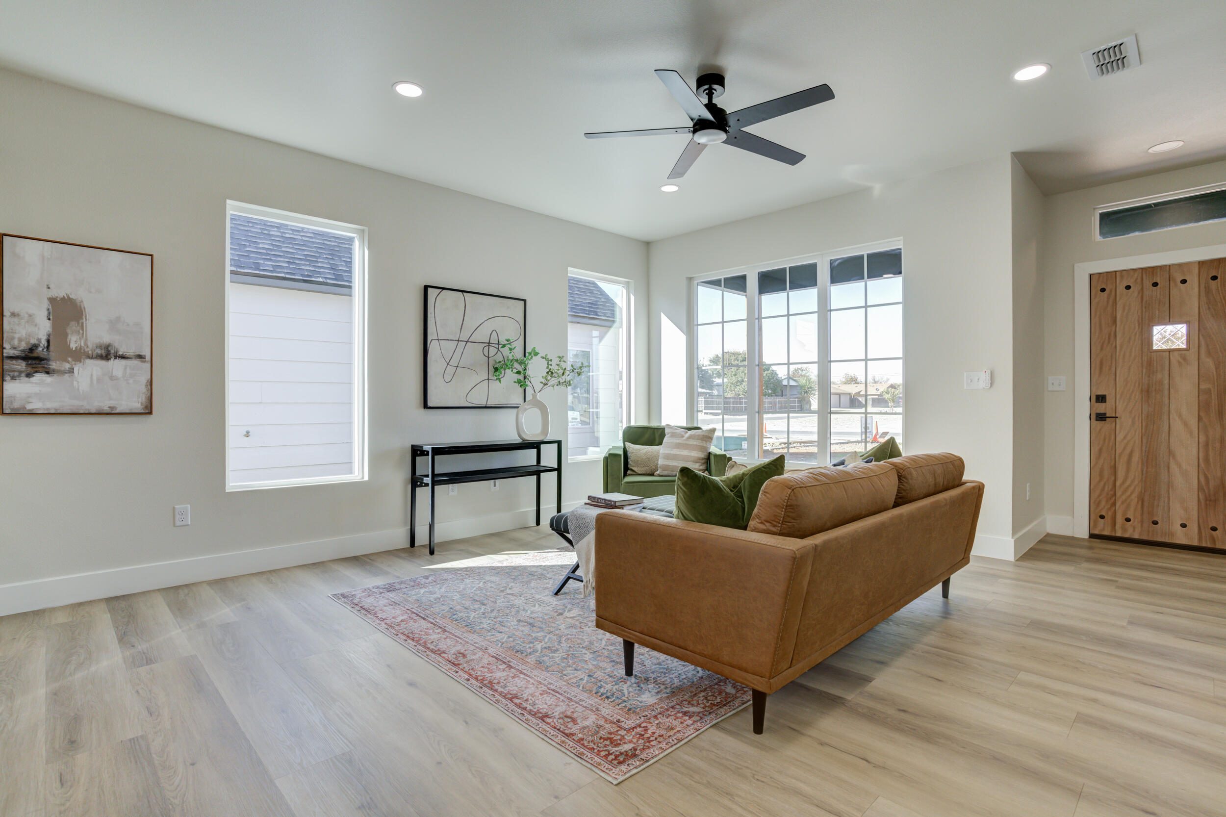 305 Southwest Ave L Seminole, TX 79360 - Photo 9 of 52 a living room with furniture and a wooden floor