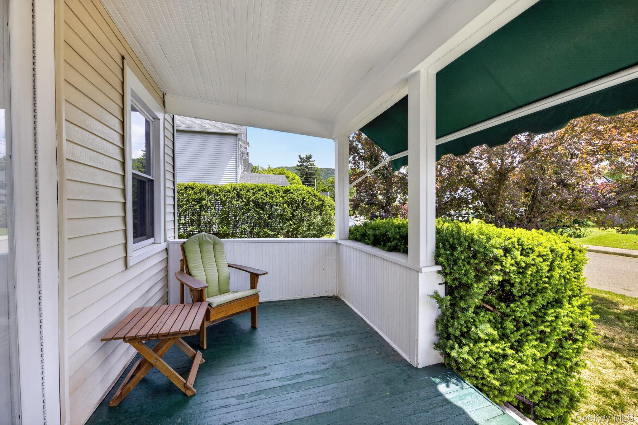 250 Rombout Avenue Beacon, NY 12508 - Photo 4 of 33 a view of a porch with furniture and a yard