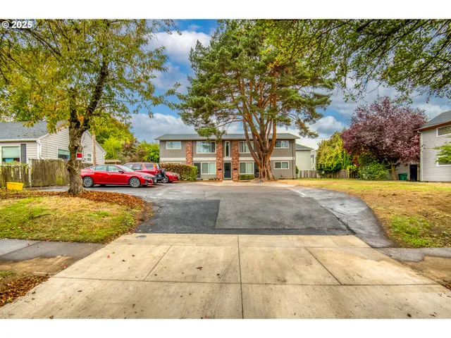 a view of street with large trees