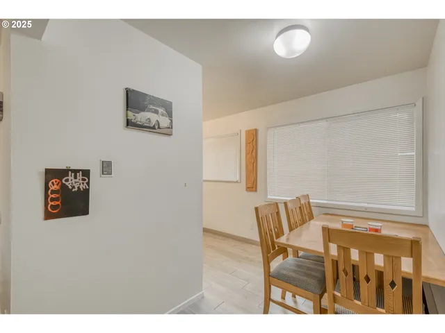 a view of room with wooden floor