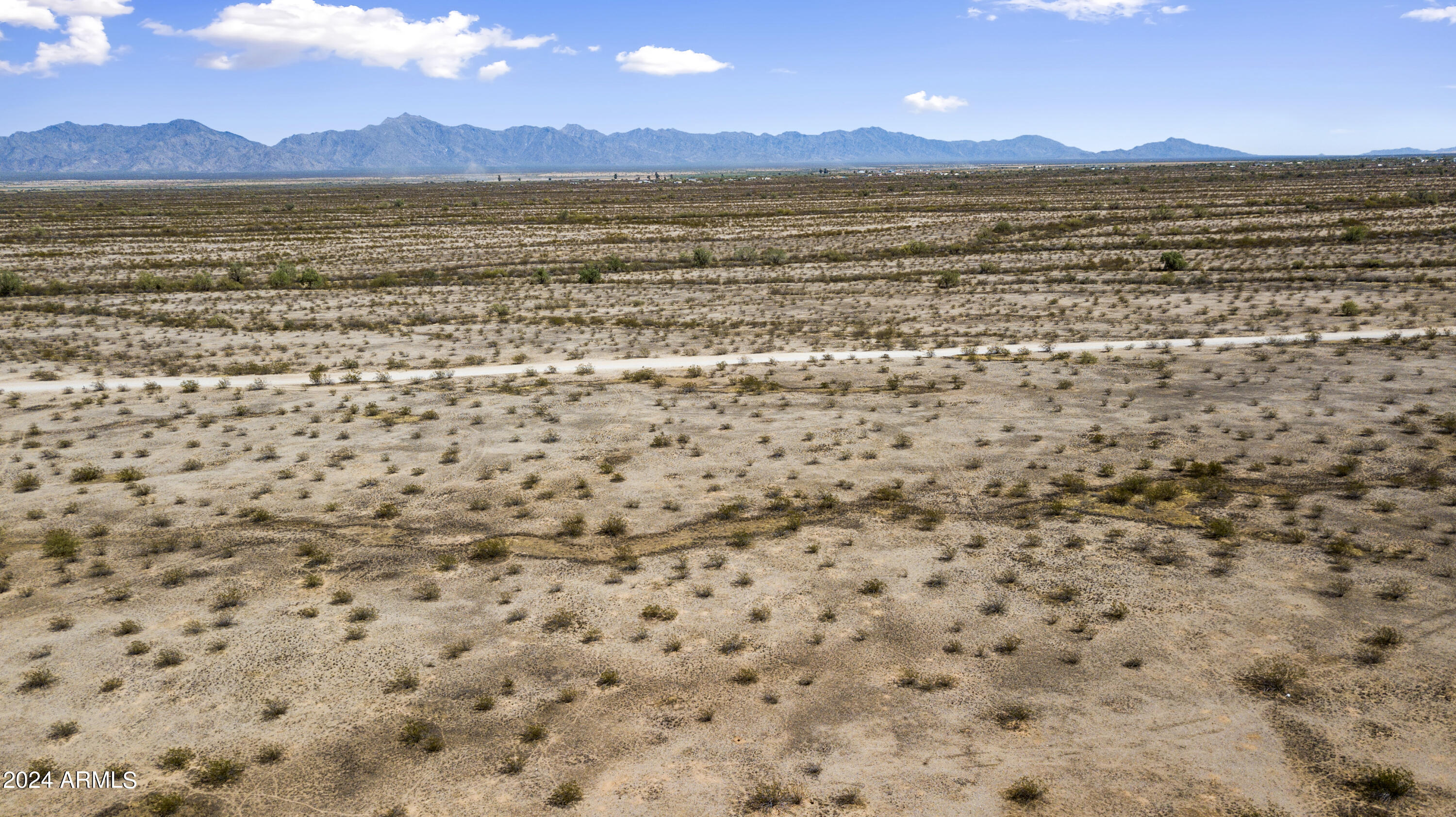 Tbd West Butterfly Road, Unit 8 Buckeye, AZ 85326 - Photo 1 of 17 a view of an ocean beach and mountain