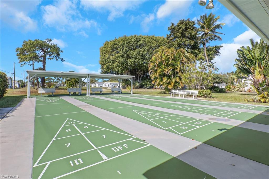 143 Moorhead Manor, Unit 143 Naples, FL 34112 - Photo 30 of 35 View of property's community with shuffleboard