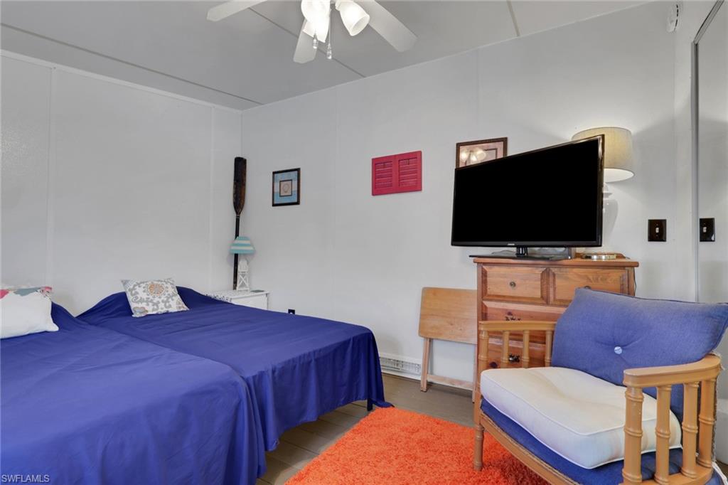143 Moorhead Manor, Unit 143 Naples, FL 34112 - Photo 31 of 35 Bedroom featuring ceiling fan