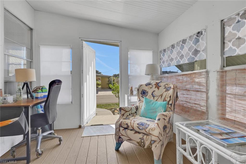 143 Moorhead Manor, Unit 143 Naples, FL 34112 - Photo 10 of 35 Home office with wood-type flooring and healthy amount of natural light