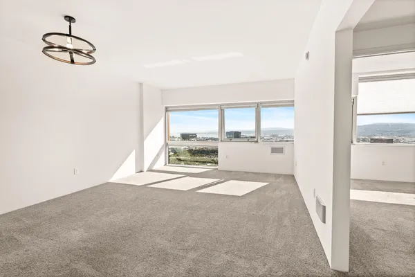 a view of an empty room with a window