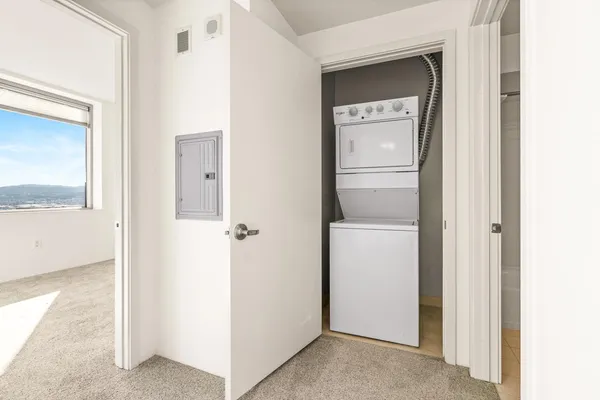 a view of a kitchen from a hallway