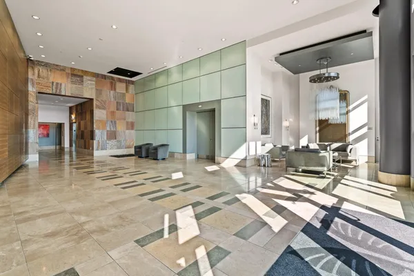 a view of a living room and kitchen