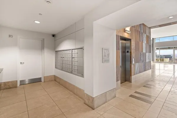 a view of an empty room with glass door