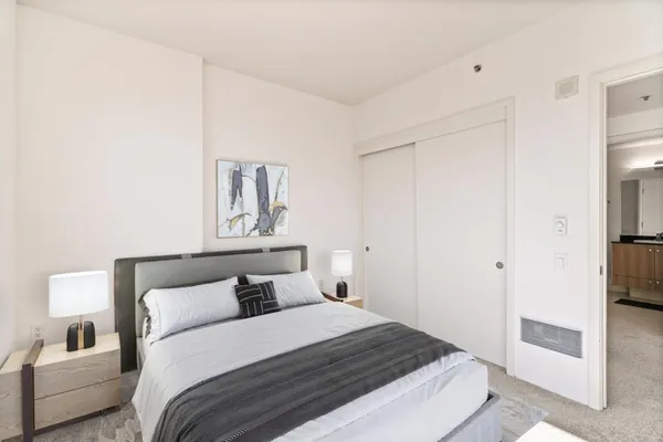 a bedroom with a bed and a couch