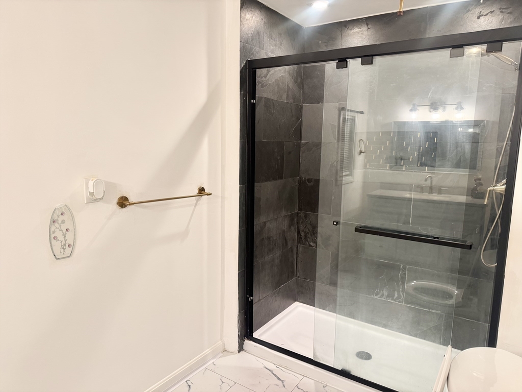 14 Addison Avenue, Unit 2 Brockton, MA 02302 - Photo 5 of 7 a bathroom with a shower and mirror