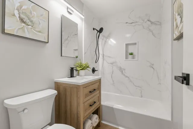 a bathroom with a sink a toilet and a bathtub